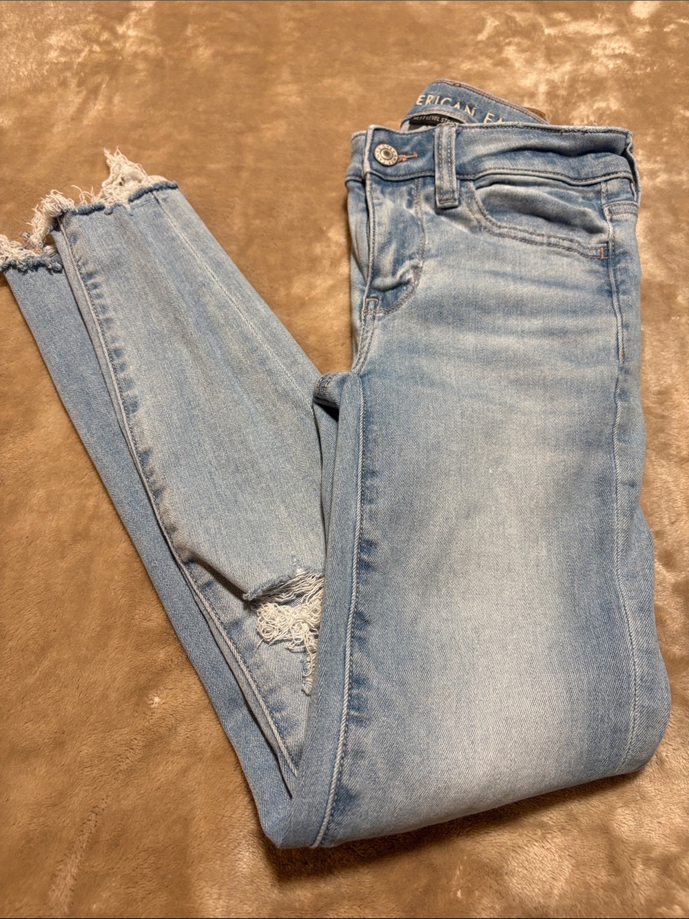 American Eagle Outfitters Light Blue Skinny Jeans with Distressed Hem